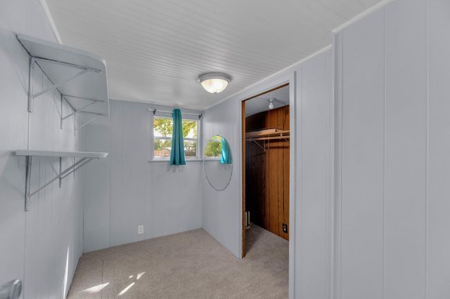 Walk in closet with carpet floors | Image 24