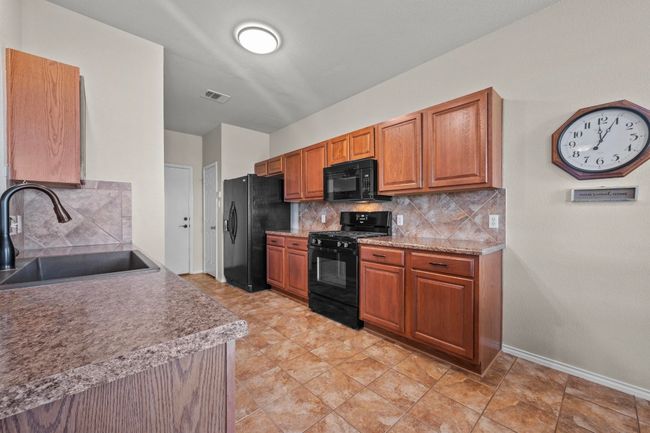A pantry and plenty of cabinetry for all of your kitchen needs! | Image 7