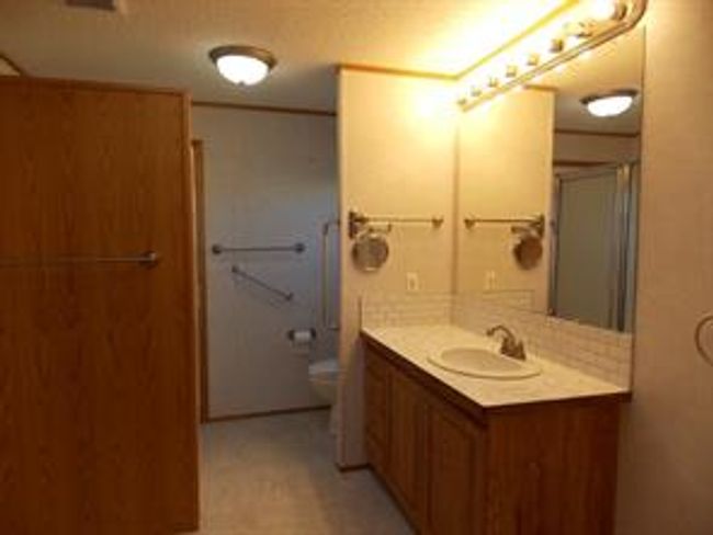 77 - 5210 65 Ave, Home with 3 bedrooms, 2 bathrooms and 3 parking in Olds AB | Image 23