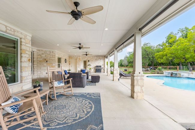 A perfect blend of comfort and nature, the back patio provides a quiet sanctuary for relaxation. | Image 32