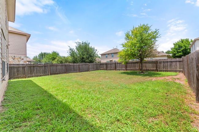 View of fenced backyard | Image 28