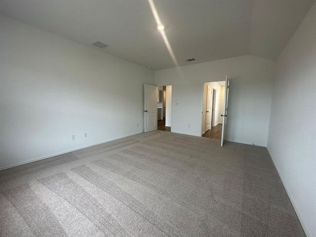 Unfurnished bedroom with carpet floors and baseboards | Image 25