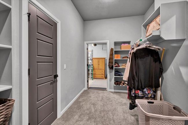 Walk in closet featuring carpet flooring | Image 36