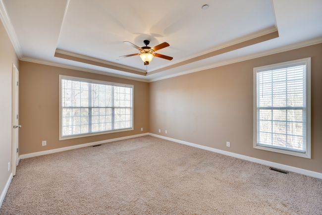 Master suite with 2 large walk-in closets and vaulted ceilings. | Image 19
