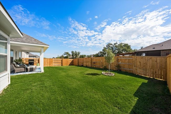 View of yard featuring a fenced backyard | Image 31