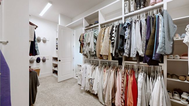 This dream-worthy master closet offers custom built-ins, abundant hanging space, and shelving galore—designed to keep everything organized and within reach while adding a touch of everyday luxury. | Image 32