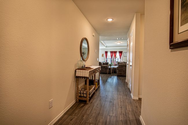 Corridor featuring dark wood-style flooring and recessed lighting | Image 22