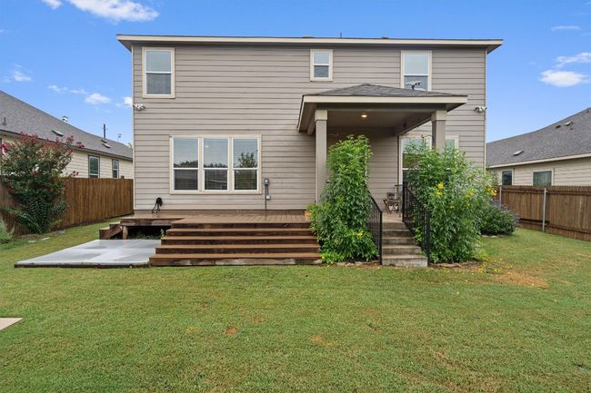Rear view of property featuring a fenced backyard and a wooden deck | Image 31