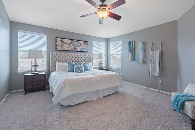 Carpeted bedroom with baseboards and ceiling fan | Image 25