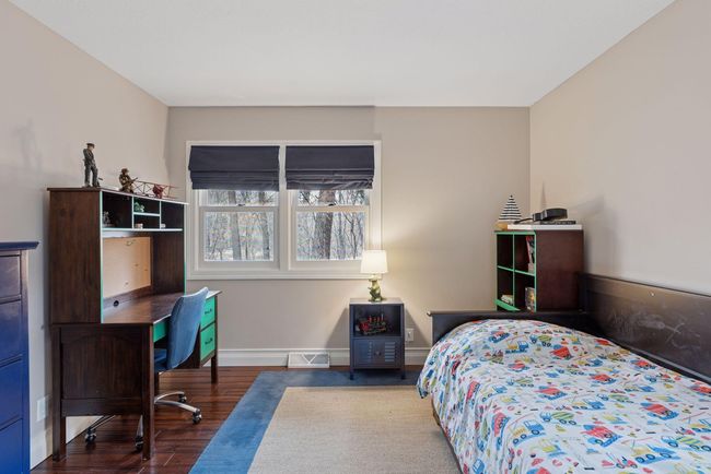 Main floor bedroom faces front of home. | Image 22