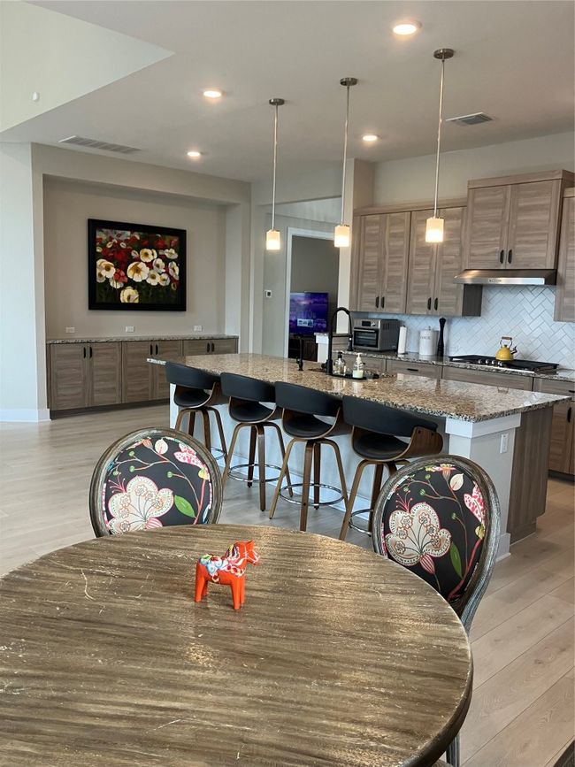Dining space featuring light wood-type flooring and recessed lighting | Image 7