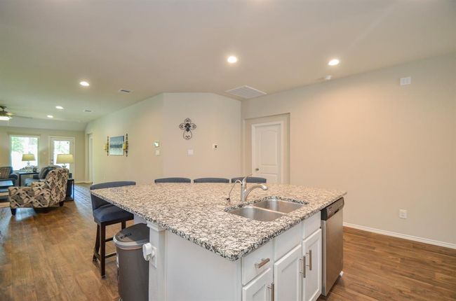 This is such an open and flowing plan! What a great gathering place for your family! | Image 7