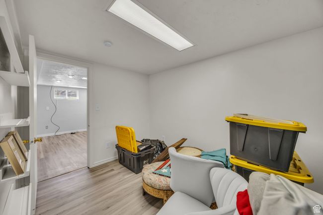 Living area featuring wood finished floors and baseboards | Image 25
