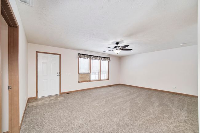 Front door entrance into living room | Image 13