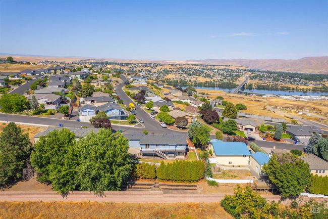 Aerial view of residential area featuring a nearby body of water | Image 46