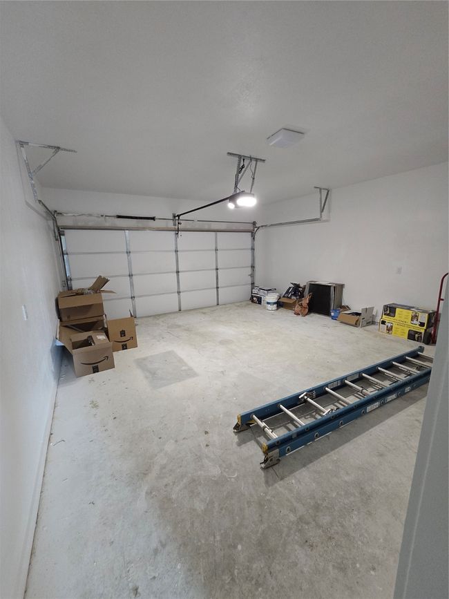Garage featuring a garage door opener | Image 10