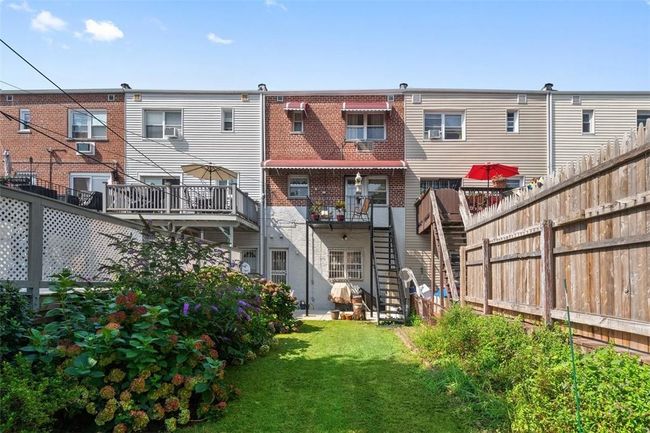Rear view of house with a yard | Image 18