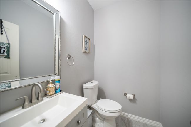 Bathroom with toilet and vanity | Image 7