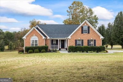 1241 Blue Springs Drive, House other with 3 bedrooms, 2 bathrooms and 4 parking in Loganville GA | Image 2