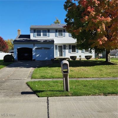 View of front of property front yard and a garage | Image 1