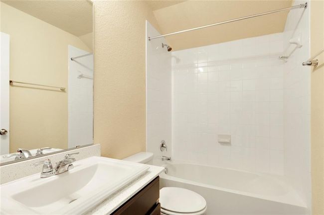 Full bathroom featuring toilet, vanity, and shower / bath combination | Image 19