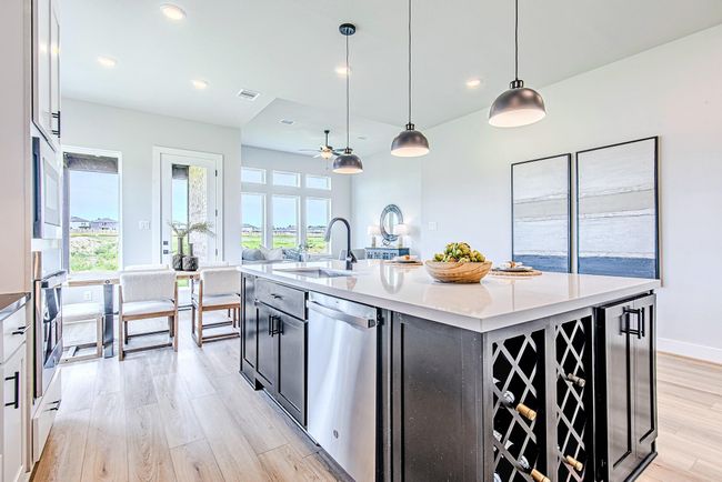 With expansive sightlines to the living area and backyard, the oversized island becomes the heart of the home—ideal for entertaining or everyday living. | Image 14