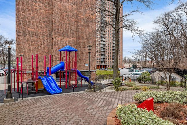 Communal playground featuring fence | Image 22