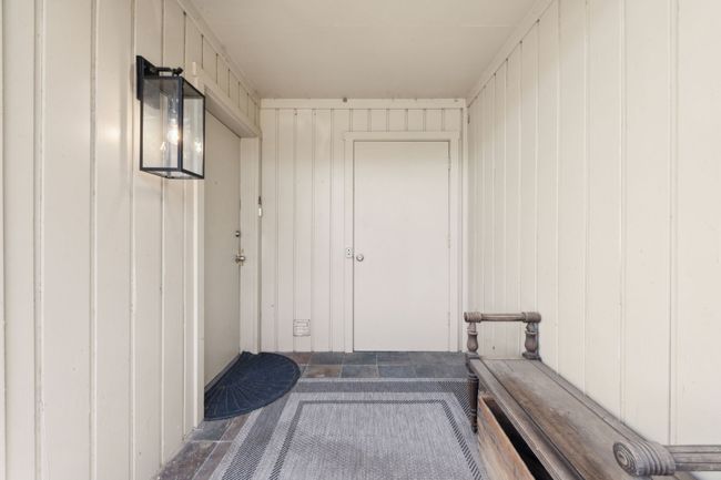 Front door patio and exterior storage closet. | Image 6