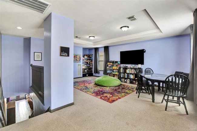 Upstairs game room, perfect for entertainment and relaxation, featuring ample space and a vibrant atmosphere. | Image 28