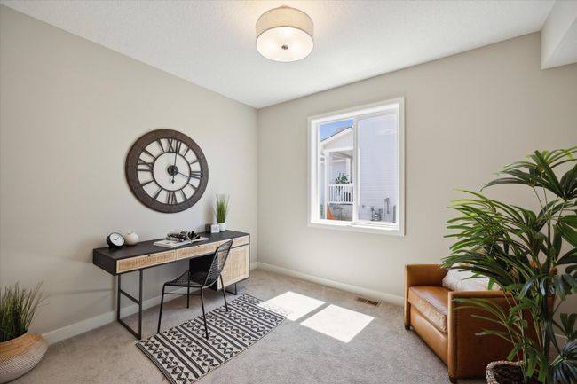 flex room tucked behind the kitchen. This is not the actual home for sale, but photos of the same floorplan. Additional options may be shown. | Image 10