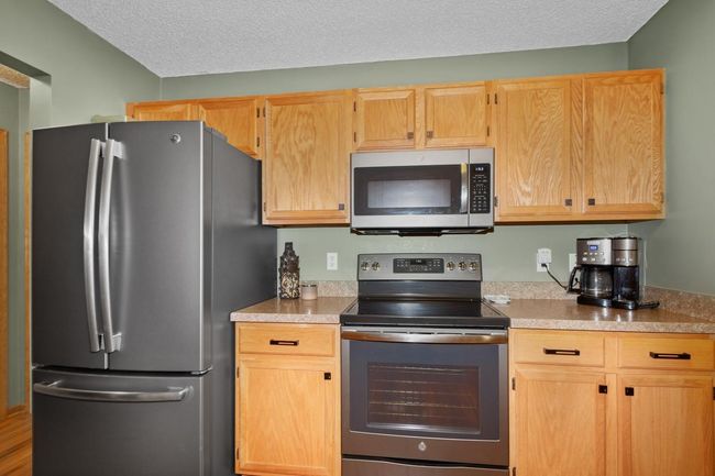 Updated Appliances are sleek. Newer countertops and cabinet pulls are a bonus! | Image 7