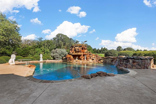 View of pool with pool water feature and a patio | Image 29