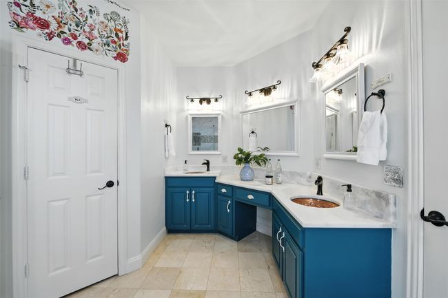 Bathroom featuring double vanity and baseboards | Image 18