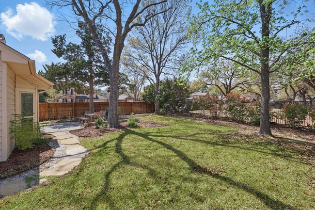 View of fenced backyard | Image 32