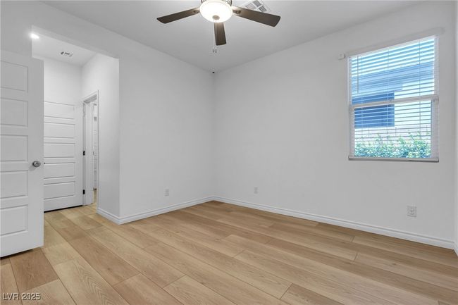 Unfurnished room featuring light wood finished floors, ceiling fan, and baseboards | Image 20