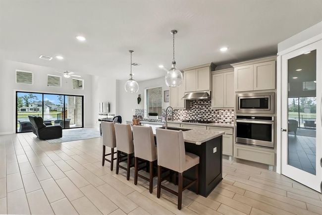 The kitchen opens into the family room | Image 11