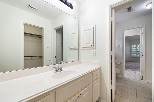 This is side one of the private vanity area and closet, before you embark on the shared wet space! All complete with cabinets and drawers for storage and a medicine cabinet too! | Image 31