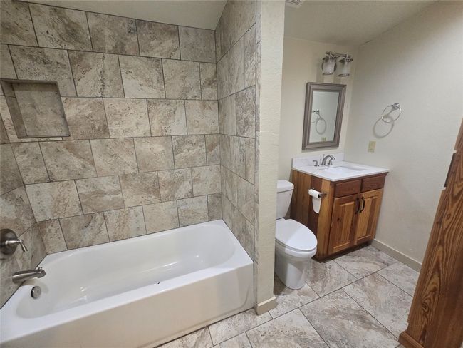 Full bathroom with vanity and bathing tub / shower combination | Image 5