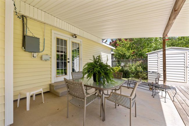 View of patio with a shed and outdoor dining space | Image 30