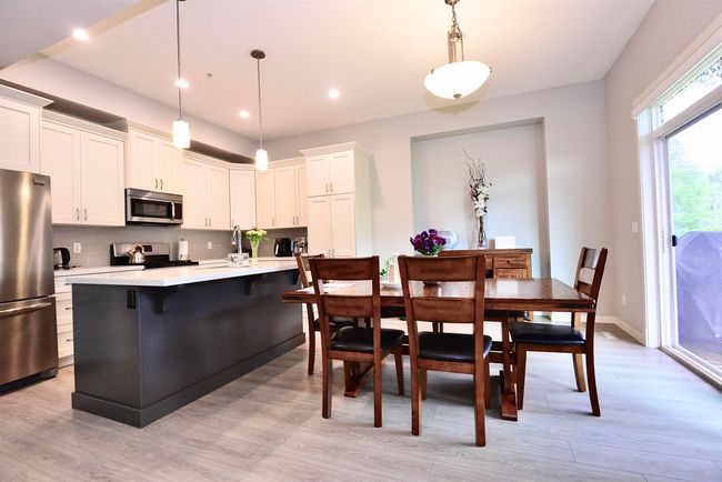 Dining area with light wood-type flooring and recessed lighting | Image 17