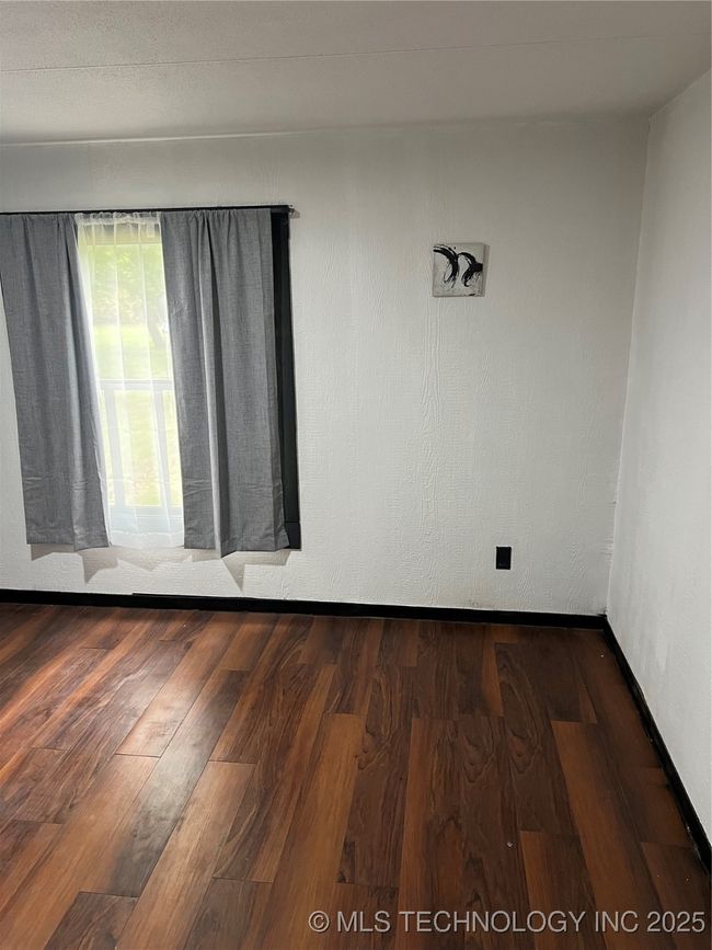 Unfurnished room featuring wood finished floors | Image 21