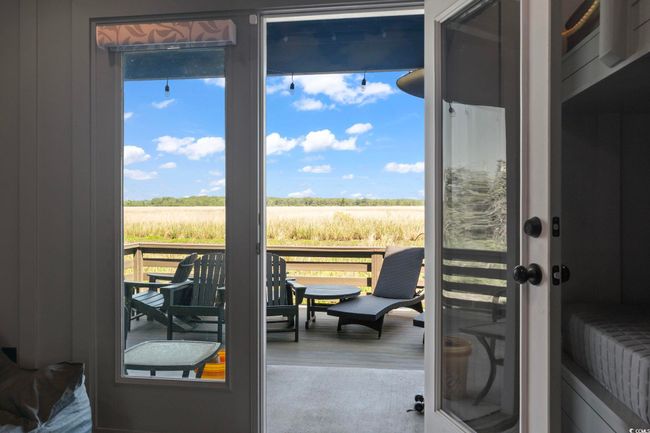 Entryway with wood finished floors and a rural view | Image 31