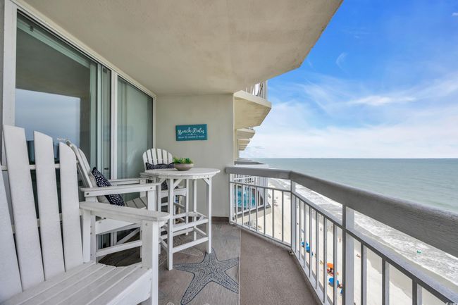 Balcony with view of water and beach | Image 21