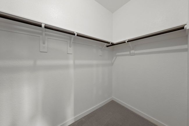 Walk in closet in the primary bedroom. | Image 16