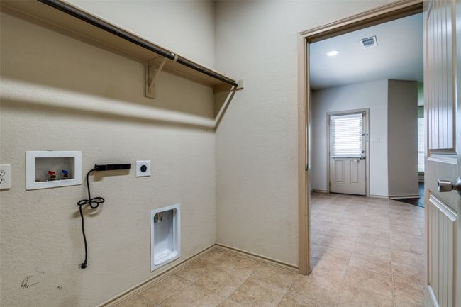 Laundry room with hookup for a washing machine and hookup for an electric dryer | Image 18