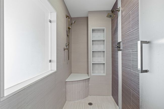 Full bathroom featuring tile walls, tile patterned flooring, and tiled shower | Image 20