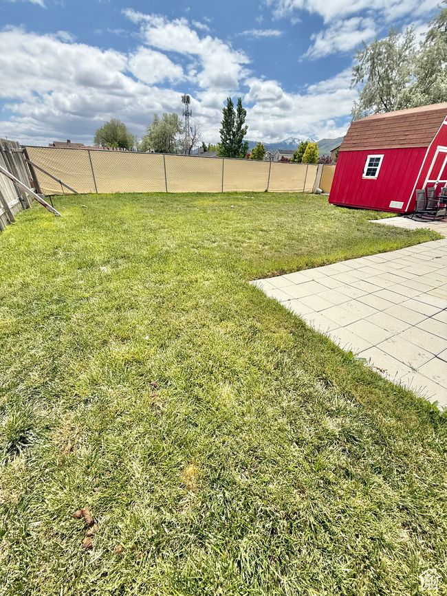 View of yard featuring a storage shed | Image 13