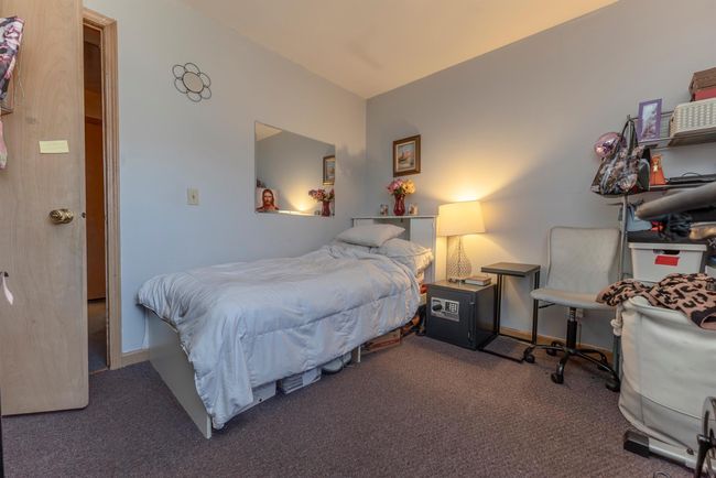 Carpeted bedroom with baseboards | Image 18