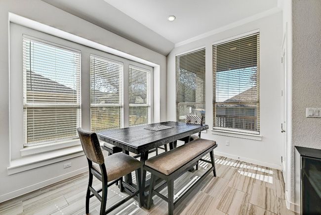 The dining area is the perfect spot for family meals or entertaining guests in style. | Image 11