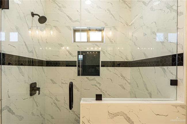 Full bathroom with a marble finish shower | Image 17
